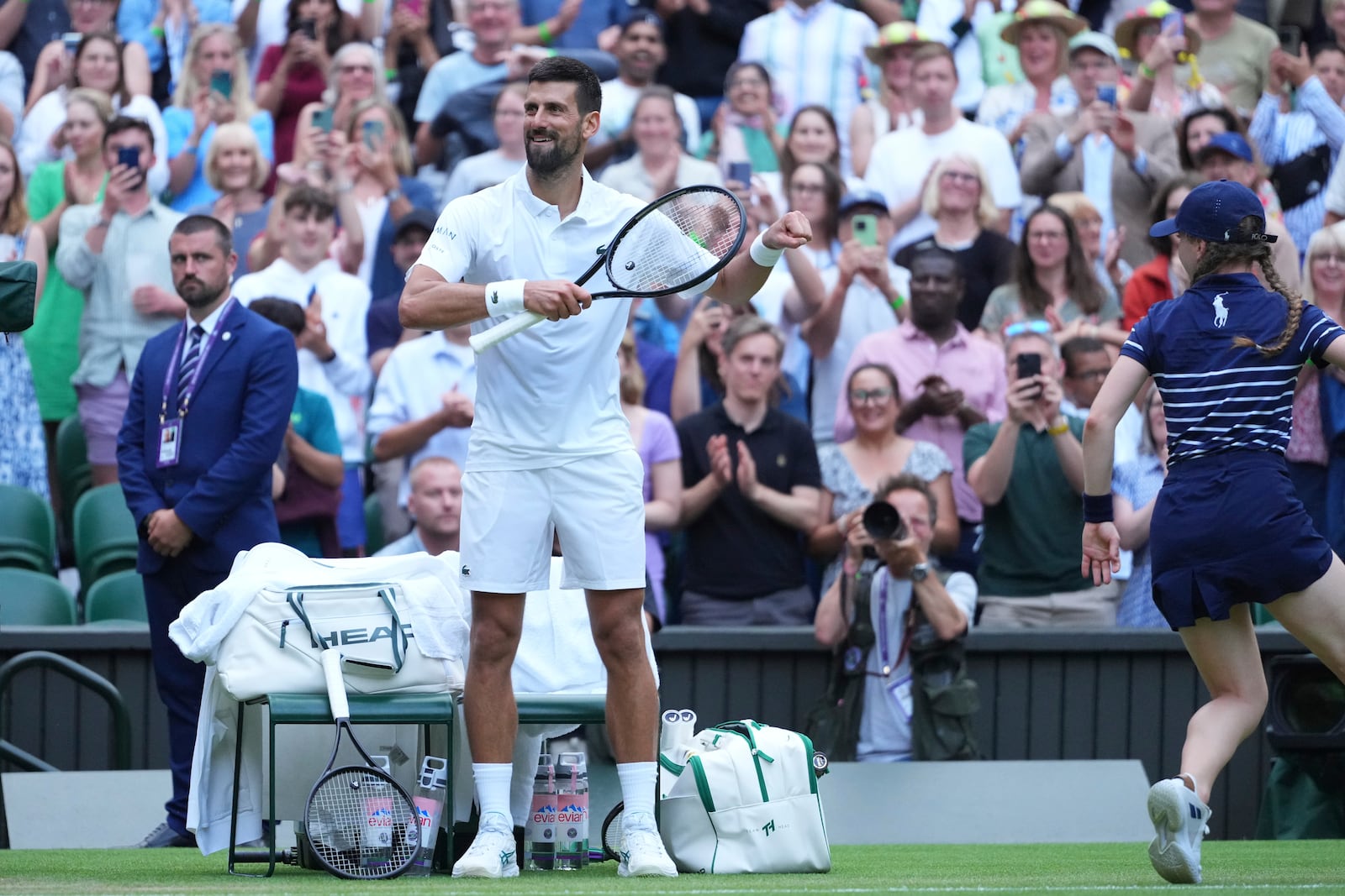 Novak Djokovic of Serbia does a dance as he celebrates beating Miomir Kecmanovic of Serbia during a third round men's singles match at the Wimbledon Tennis Championships in London, Saturday, July 5, 2025. (AP Photo/Kirsty Wigglesworth)