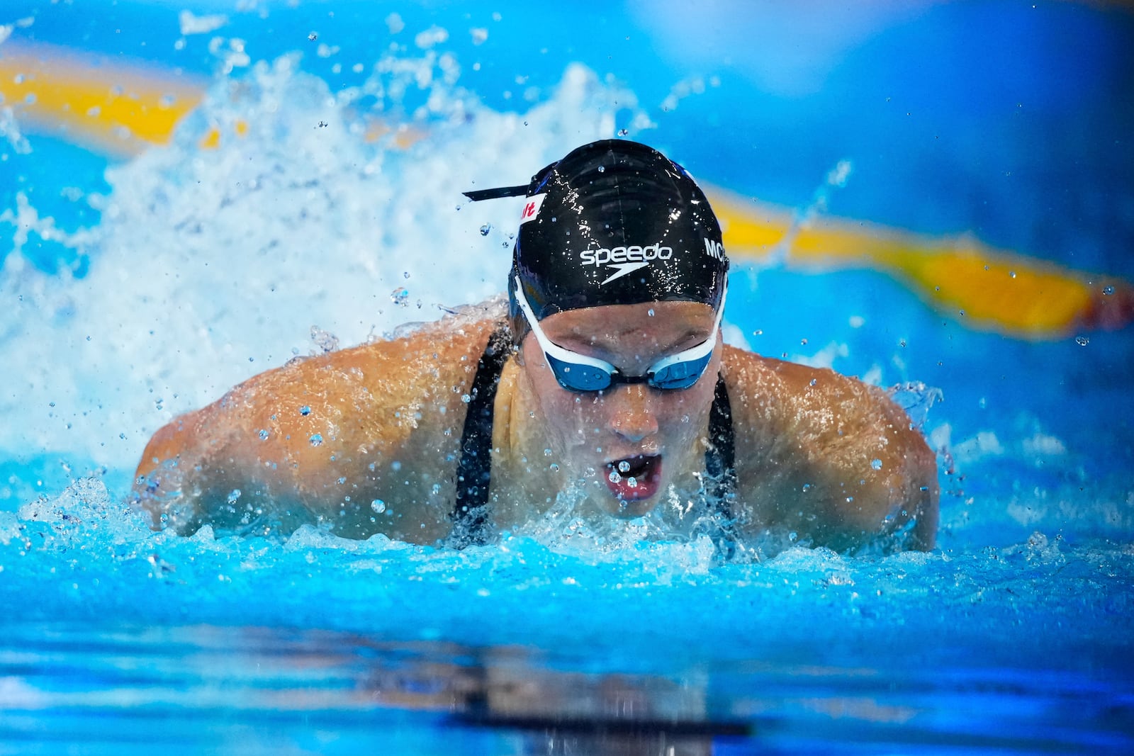 Summer Mcintosh of Canada competes in the women's 200-meter individual medley heat at the World Aquatics Championships in Singapore, Sunday, July 27, 2025. (AP Photo/Vincent Thian)