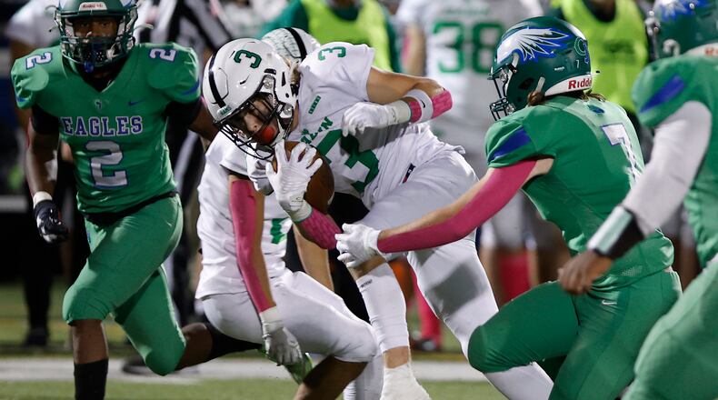Badin's Austin Buckle carries the ball into the CJ secondary. BILL LACKEY/STAFF