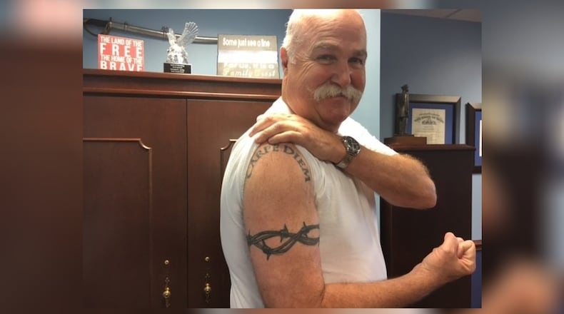 Butler County Sheriff Richard Jones shows two of four tattoos he received in the past three years. LAUREN PACK/STAFF
