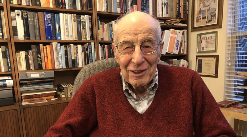 Dr. Al Miller, 97, a Holocaust survivor, was an optometrist in Hamilton for more than 40 years before retiring and moving to Deerfield Twp. Miller makes about 50 to 60 speaking engagements a year to talk to students about the Holocaust. He converted a bedroom into an extensive library. RICK McCRABB/STAFF