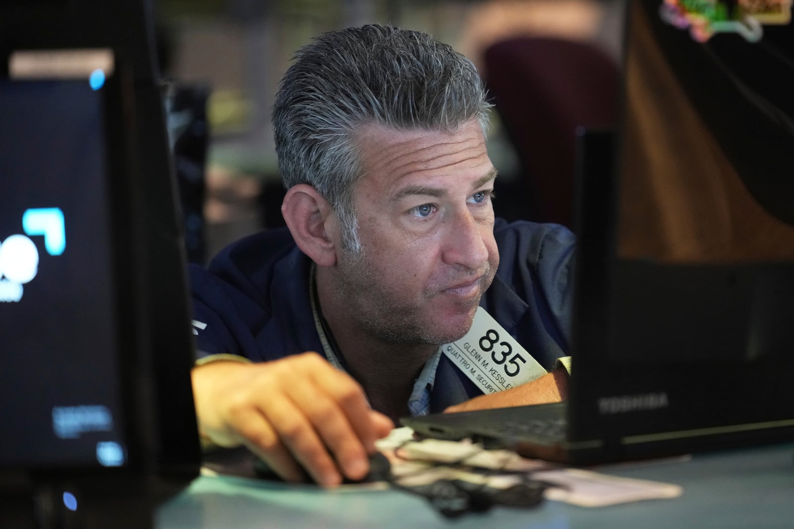 Glenn Kessler works on the floor at the New York Stock Exchange in New York, Wednesday, April 9, 2025. (AP Photo/Seth Wenig)