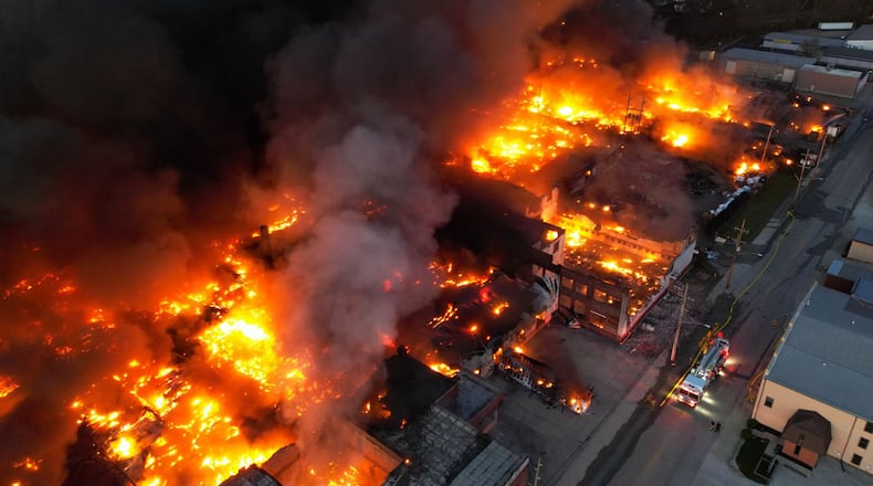 A plume of thick, black smoke traveled for miles that was coming from the massive and toxic industrial fire Tuesday, April 11, 2023, at a recycling facility in Richmond, Indiana. NICK GRAHAM/STAFF