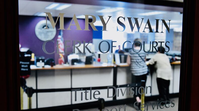Inflation has delayed the opening of Butler County Clerk of Courts Mary Swain's new title office in the Middletown area . NICK GRAHAM/STAFF