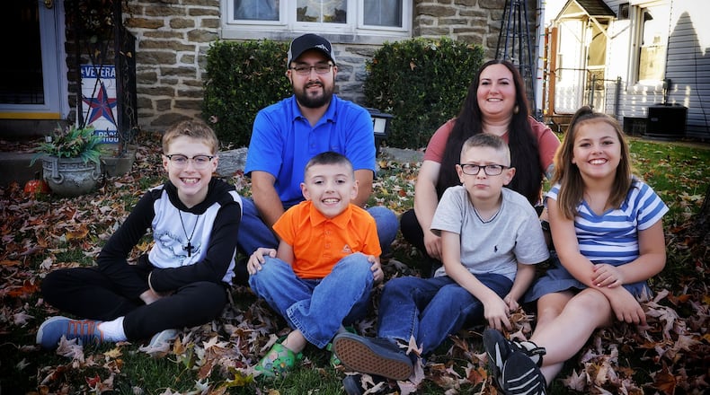 Shania and Tyler Cox are adopting two siblings Matthew, 10, left, and Billie, 8, right, on National Adoption Day. They already have two biological kids Zeke, 7, and T.J., 8. NICK GRAHAM/STAFF
