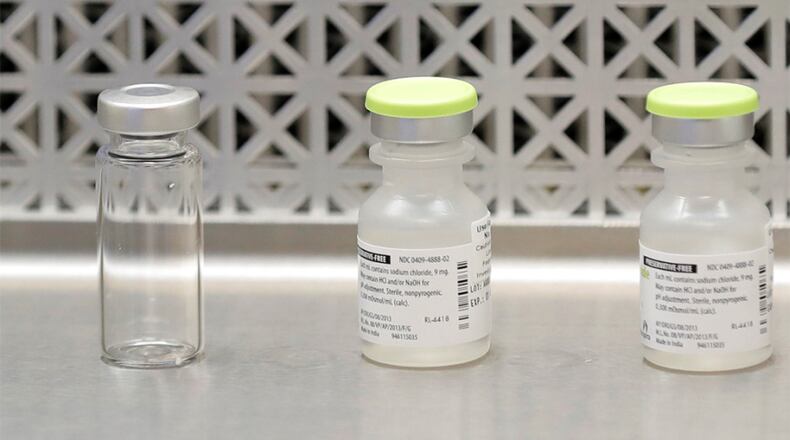 This March 16, 2020, photo shows vials used by pharmacists to prepare syringes used on the first day of a first-stage safety study clinical trial of the potential vaccine for COVID-19, the disease caused by the new coronavirus, at the Kaiser Permanente Washington Health Research Institute in Seattle. The world’s biggest COVID-19 vaccine test got underway Monday, July 27 with the first of 30,000 planned volunteers. The experimental vaccine is made by the National Institutes of Health and Moderna Inc., and it’s one of several candidates in the final stretch of the global vaccine race.