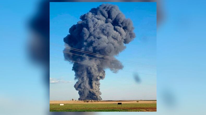 In this photo provided by Castro County Emergency Management, smoke fills the sky after an explosion and fire at the Southfork Dairy Farms near Dimmitt, Texas, on Monday, April 10, 2023. The explosion at the dairy farm in the Texas Panhandle that critically injured one person and killed an estimated 18,000 head of cattle is the deadliest barn fire recorded since the Animal Welfare Institute began tracking the fires. (Castro County Emergency Management via AP)