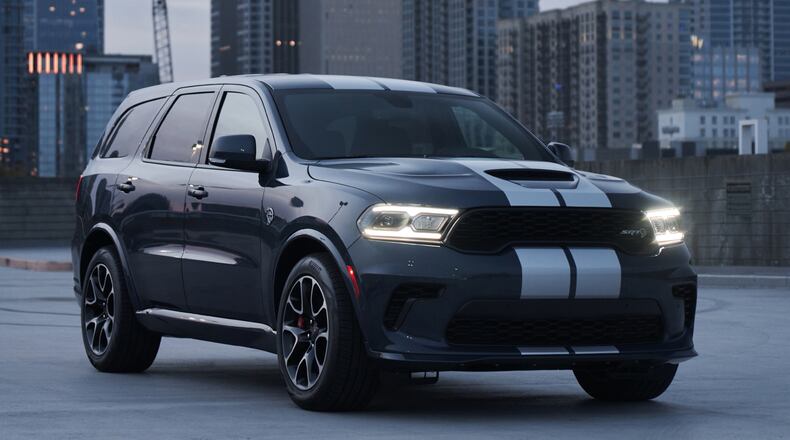 2021 Dodge Durango SRT Hellcat: The most powerful SUV ever features a new aggressive exterior, a new interior with a driver-centric cockpit and delivers 710 horsepower, shown here in Reactor Blue with Dual Silver stripes. Dodge photo
