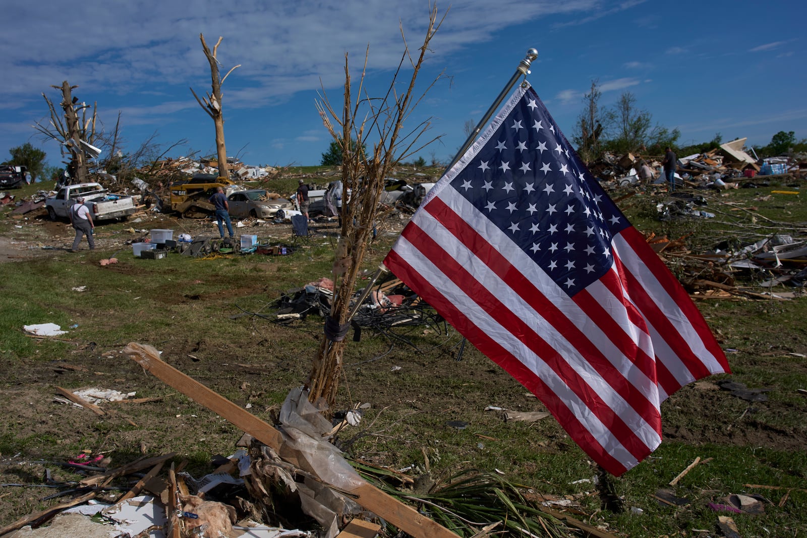 An American Flag is posted near destroyed homes, Sunday, May 18, 2025, in London, Ky., after a severe storm passed through the area. (AP Photo/Carolyn Kaster)