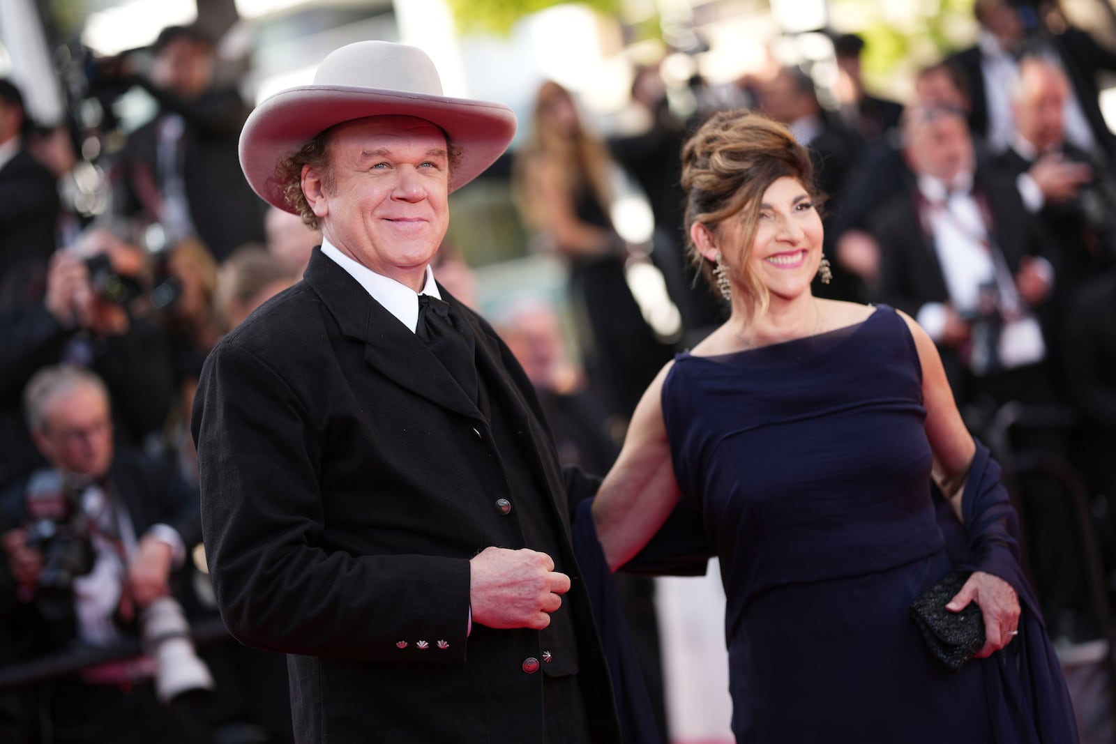 John C. Reilly, left, and Alison Dickey pose for photographers during the awards ceremony red carpet at the 78th international film festival, Cannes, southern France, Saturday, May 24, 2025. (Photo by Scott A Garfitt/Invision/AP)