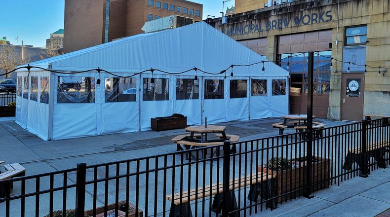 Municipal Brew Works hopes its new heated tent and award-winning hard seltzer will be key to attracting customers during the cold winter months. NICK GRAHAM / STAFF