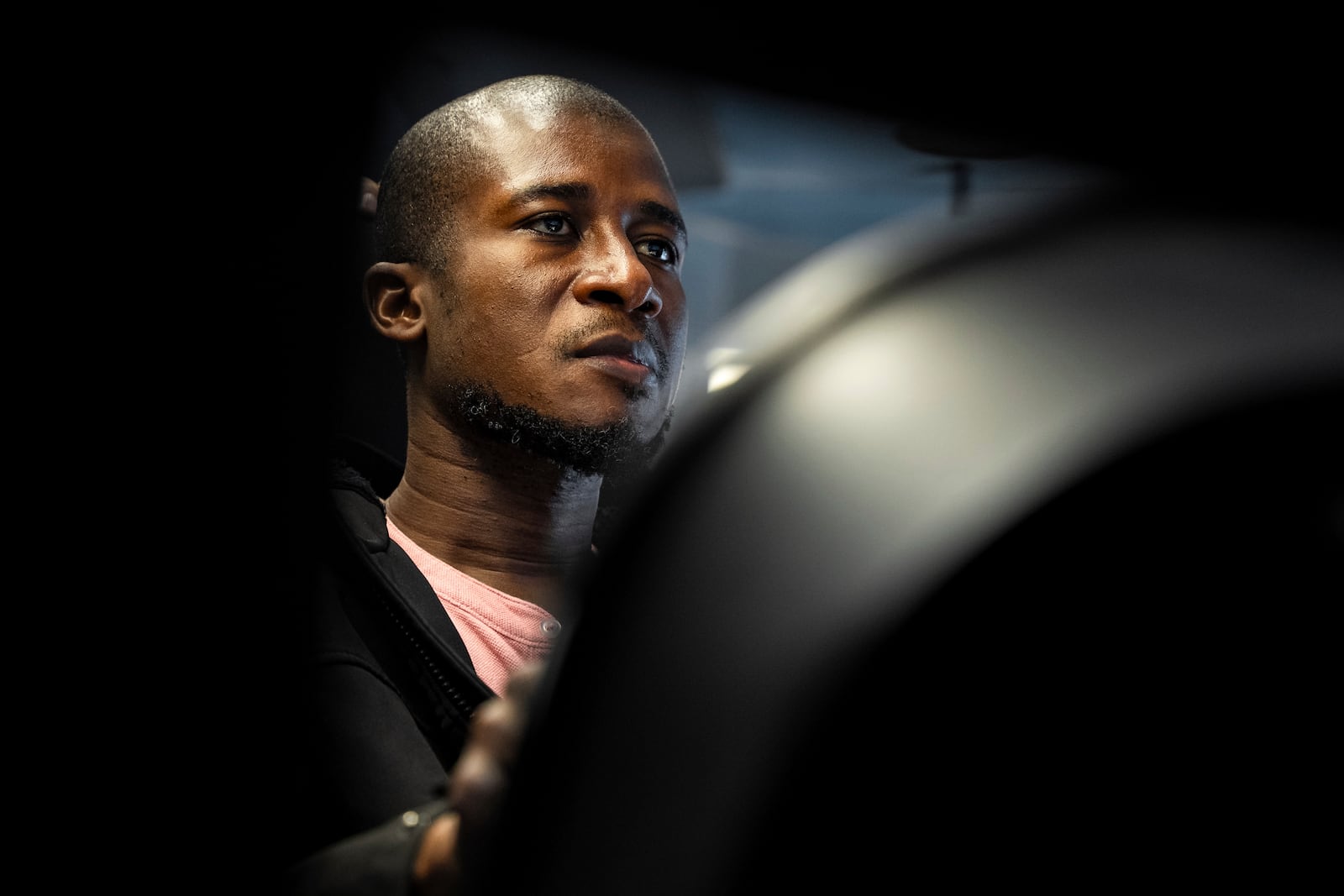 Mohammed Kamal practices handling a tractor-trailer truck in a driving simulator at the Driving Academy on Tuesday, June 10, 2025 in Linden, N.J., where students prepare to obtain a Commercial Driver’s License (CDL) with multilingual instructors. (AP Photo/Angelina Katsanis)