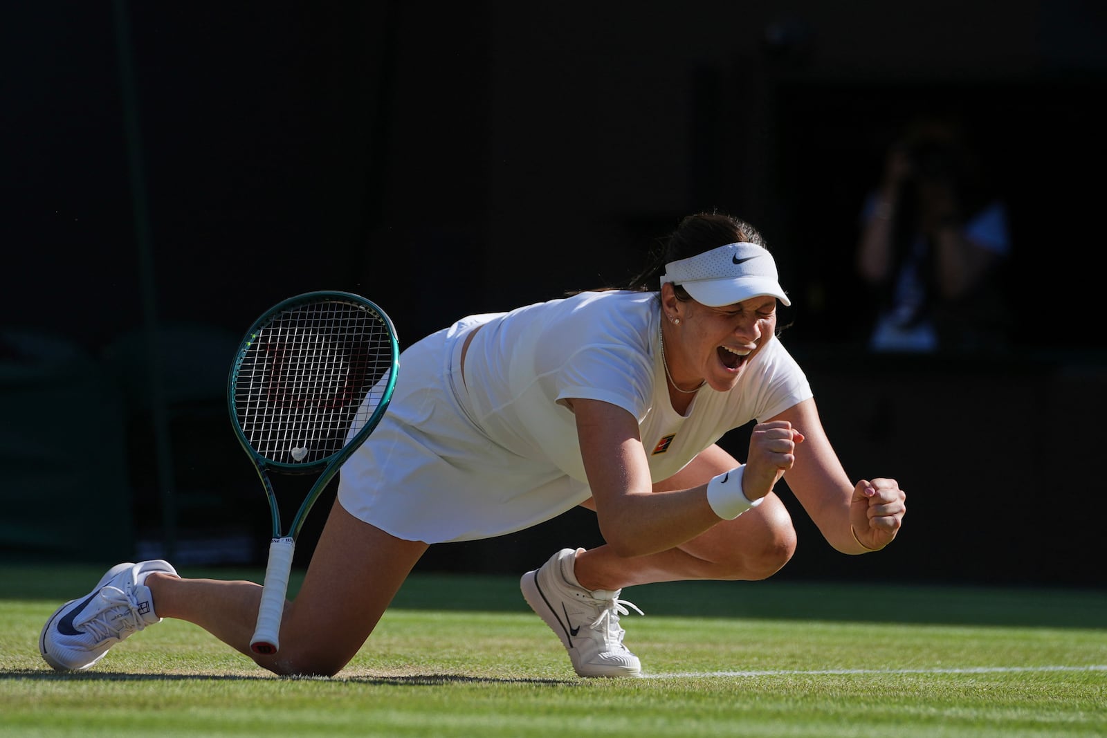 Amanda Anisimova of the U.S. celebrates winning the women's singles quarter finals match against Anastasia Pavlyuchenkova of Russia at the Wimbledon Tennis Championships in London, Tuesday, July 8, 2025.(AP Photo/Kin Cheung)