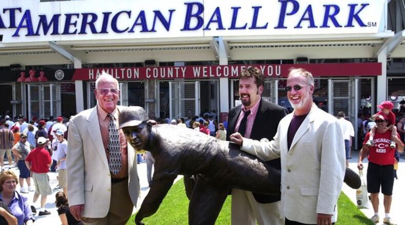 Pictured is the Reds Hall of Fame pitcher and former longtime radio announcer, the late Joe Nuxhall, with his sons, Kim (at right) and Phil. Pictured is when the elder Nuxhall had his statue dedicated outside Great American Ball Park in downtown Cincinnati. PROVIDED