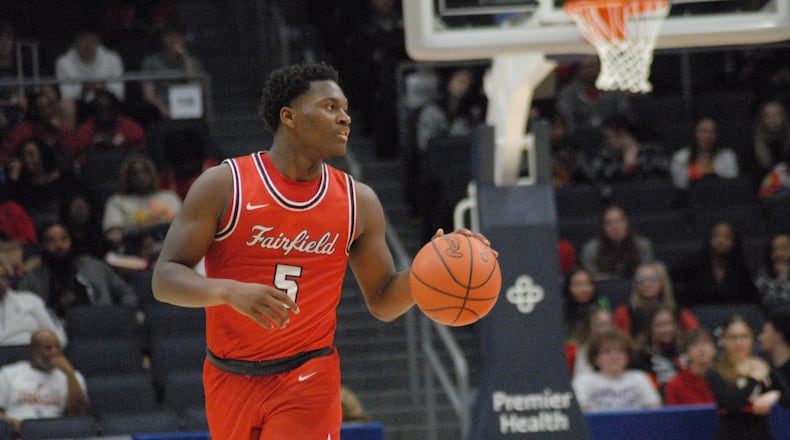 Fairfield senior Ray Coney (5) dribbles the ball up court against Wayne during a Division I district final on Saturday night at UD Arena. The Indians won 76-51.. Chris Vogt/CONTRIBUTED
