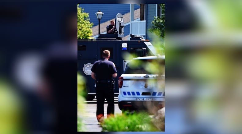 Ohio Gov. John Kasich signed a bill on March 1 that optionally allows a paramedic, or a trained medical personnel, attached to a SWAT team to carry a firearm when called so long as they are trained and authorized to carry the weapon. Pictured is a member of the West Chester Police SWAT team back in April 2017 when called out to the Landings at Beckett Ridge. NICK GRAHAM/FILE