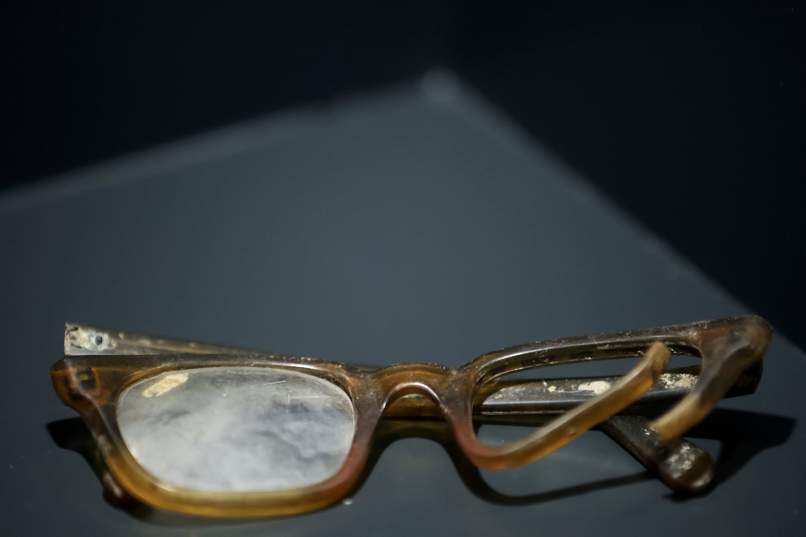 Glasses found in a mass grave are shown as a part of the exhibition "Lives Beyond the Fields of Death" opened at the Srebrenica Memorial Center in Potocari, Bosnia, Thursday, July 10, 2025. (AP Photo/Armin Durgut)