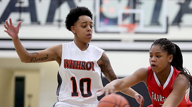 Fairfield guard Journee Hicks passes around Withrow guard Jerria White during Saturday afternoon’s Division I sectional game at Lakota East. CONTRIBUTED PHOTO BY E.L. HUBBARD