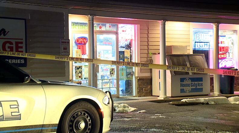 Crime scene tape outside Madeira Beverage, where owner Roop Gupta was shot to death Feb. 9, 2021. WCPO-TV