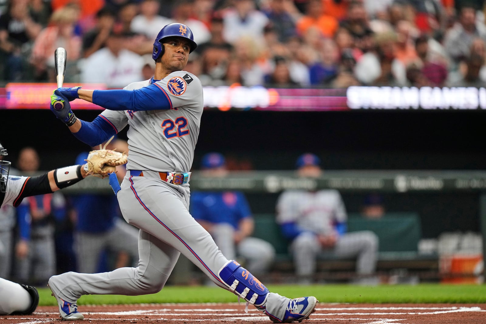 New York Mets' Juan Soto (22) strikes out swinging during the first inning of a baseball game against the Baltimore Orioles, Tuesday, July 8, 2025, in Baltimore. (AP Photo/Stephanie Scarbrough)