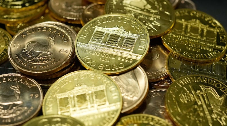 FILE - 1 Ounce Fine Gold Coins are displayed in the safe deposit boxes room at the Pro Aurum gold house in Munich, Germany, Friday, April 25, 2025. (AP Photo/Matthias Schrader, File)