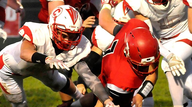 Madison quarterback Mason Whiteman (7) recovers his own fumble during the second quarter of a Southwestern Buckeye League game against Carlisle on Oct. 7, 2016, in Madison Township. The visiting Indians won 21-19. CONTRIBUTED PHOTO BY DAVID A. MOODIE