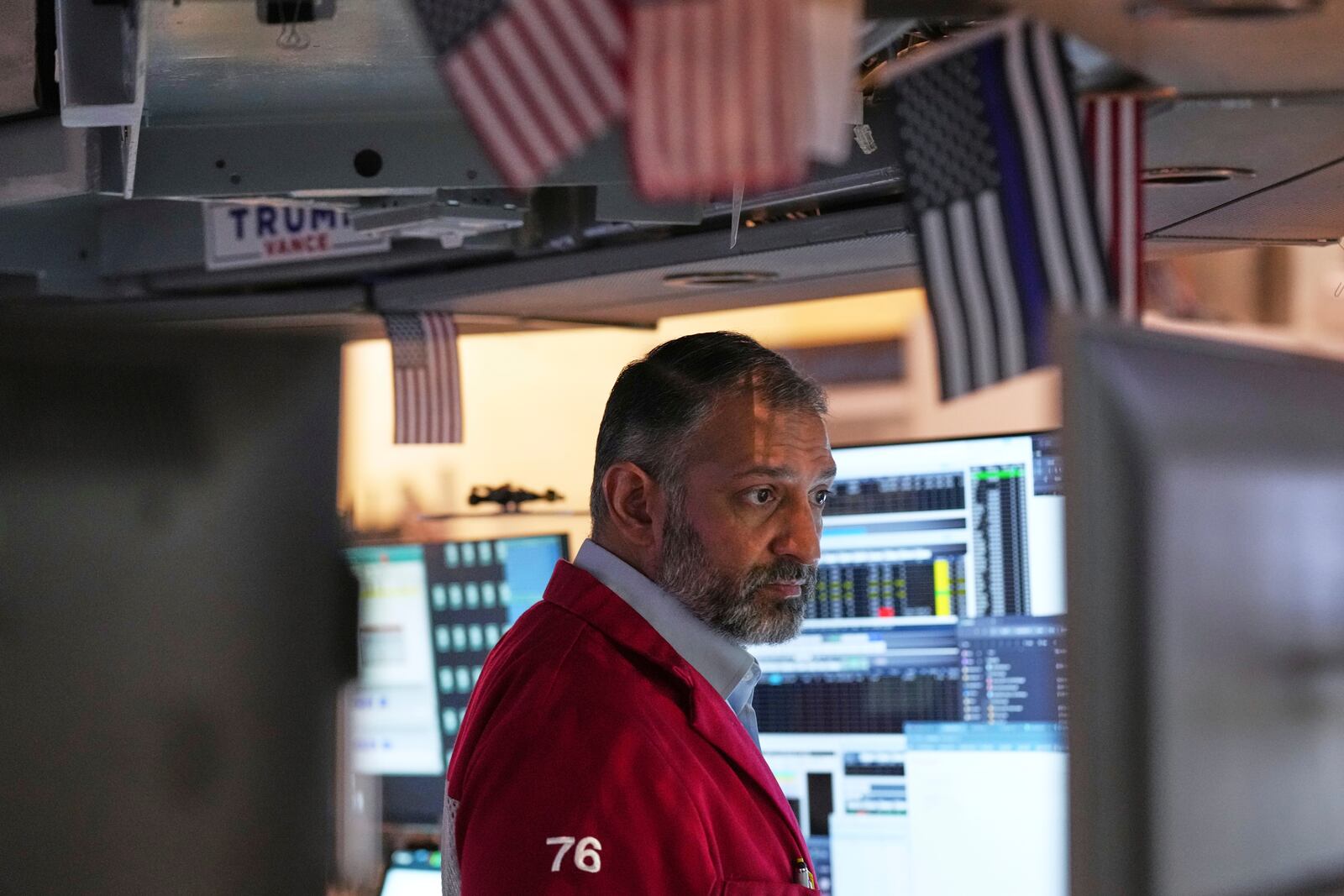 Aman Patel works on the floor at the New York Stock Exchange in New York, Thursday, April 3, 2025. (AP Photo/Seth Wenig)