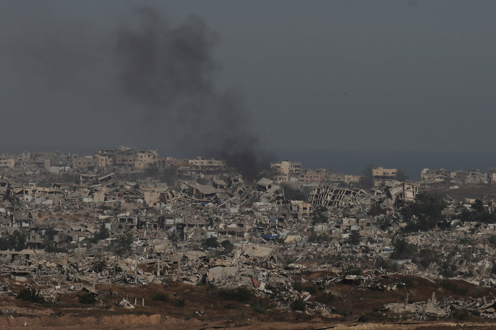 Smoke rises to the sky in the Gaza Strip as seen from southern Israel, Wednesday, April 30, 2025. (AP Photo/Ohad Zwigenberg)
