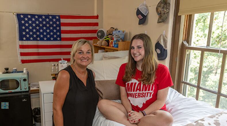 Laura Everett Bowling, left, and her daughter Sarah Bowling, shown on move-in day Thursday, Aug. 24, 2023, were assigned the same Emerson Hall room 33 years apart at Miami University. SCOTT KISSELL/CONTRIBUTED
