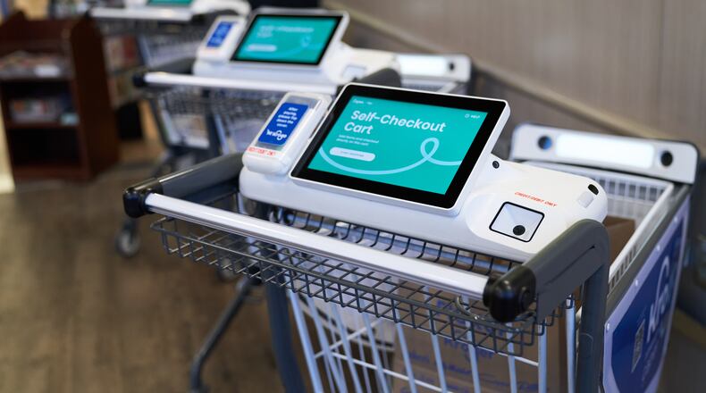 The Monroe Kroger now offers 10 new KroGO shopping carts, which allow shoppers to scan as they go and the ability to avoid the checkout. CONTRIBUTED