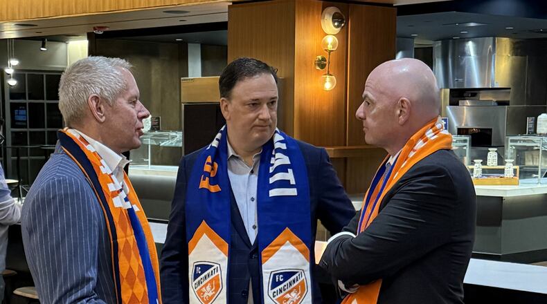 FC Cincinnati controlling owner Carl Lindner III (left) and Co-CEO Jeff Berding (middle) speaking with FIFA President Gianni Infantino. Laurel Pfahler/CONTRIBUTED PHOTO