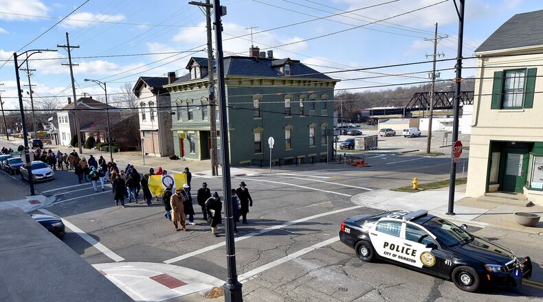More than 60 people participated in a recent Hamilton Martin Luther King, Jr. Day march that started at the Booker T. Washington Community Center and followed Front Street to High Street to South Martin Luther King Jr. Boulevard to Ludlow Street where it ended at Payne Chapel AME Church. NICK GRAHAM/STAFF