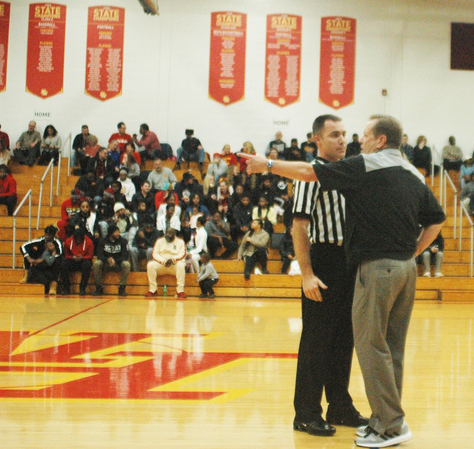 Badin coach Gerry Weisgerber makes a point to an official during Friday night’s game at Purcell Marian’s Eveslage Athletic Center. Purcell won 74-60. RICK CASSANO/STAFF