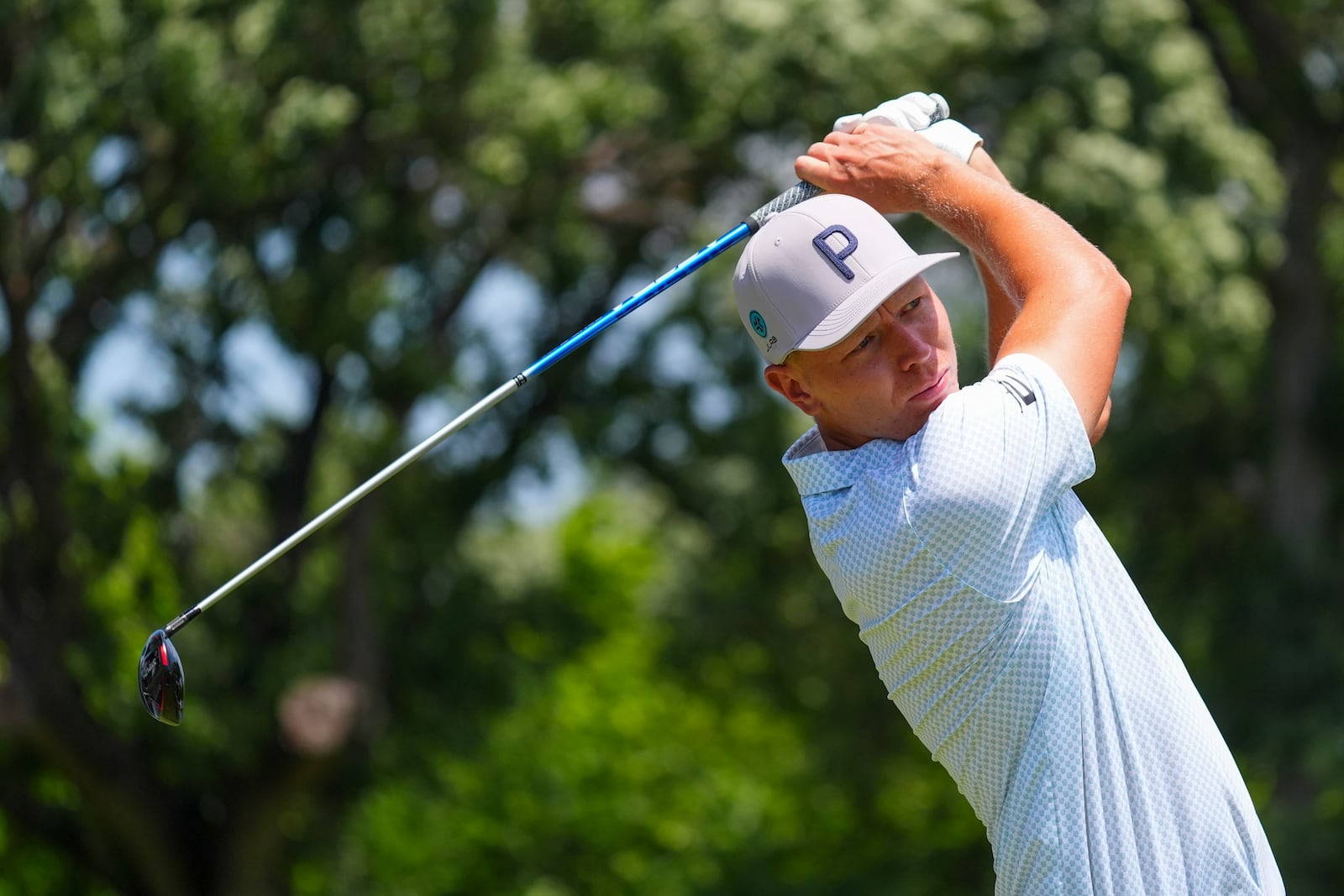 Matti Schmid hits a tee shot on the third hole during the final round of the Charles Schwab Challenge golf tournament at Colonial Country Club in Fort Worth, Texas, Sunday, May 25, 2025. (AP Photo/LM Otero)