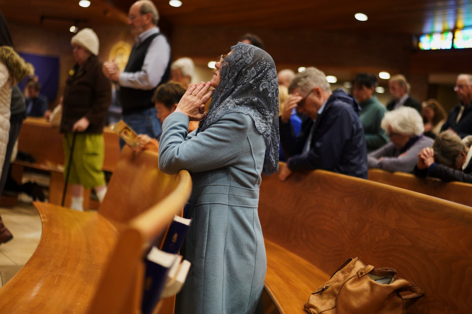 A parishioner prays during a morning Mass at St. Mary of the Immaculate Conception Catholic Church in Fredericksburg, Va., on Wednesday, April 9, 2025. (AP Photo/Jessie Wardarski)