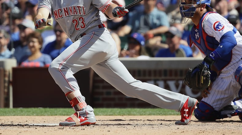 CHICAGO, IL - MAY 18: Adam Duvall #23 of the Cincinnati Reds hits a run scoing single in the 7th inning against the Chicago Cubs at Wrigley Field on May 18, 2017 in Chicago, Illinois. (Photo by Jonathan Daniel/Getty Images)