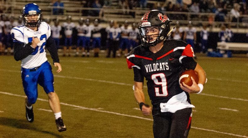 Franklin quarterback Braden Woods rushes for 8 yards to the 1. He scored on the next play to give the Wildcats a 14-12 lead late in the first half Friday night at Franklin. Jeff Gilbert/CONTRIBUTED
