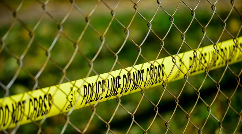 Police tape remains in front of the Lafayette Avenue home of Joe Romano who was shot to death early Friday morning. NICK GRAHAM/STAFF