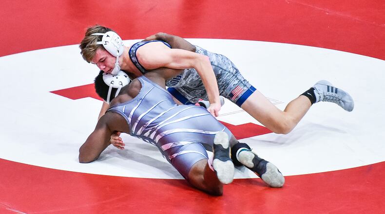 Edgewood’s Canaan Kuykendoll wrestles Xenia’s Desmond Diggs in the 132-pound weight class during the Ron Masanek Fairfield Invitational on Jan. 11 at Fairfield High School. NICK GRAHAM/STAFF