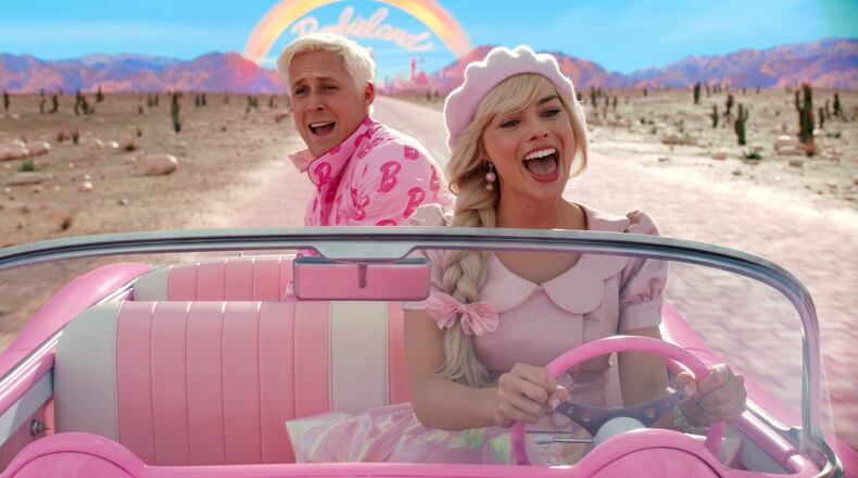 This image released by Warner Bros. Pictures shows Ryan Gosling, left, and Margot Robbie in a scene from "Barbie." Earlier this week “Barbie” passed “The Super Mario Bros. Movie” to become the biggest box-office hit in North America this year.(Warner Bros. Pictures via AP)