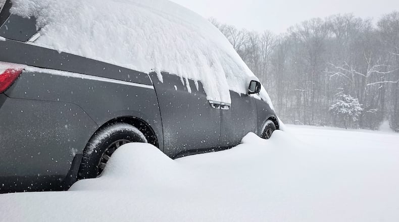 Overnight snow covers a vehicle Sunday morning, Jan. 25, 2026 in Madison Twp. By 10 a.m. Sunday, the region had experienced nearly 12 inches of snow, with more on the way. Visit Journal-News.com for the latest snow coverage. NICK GRAHAM/STAFF