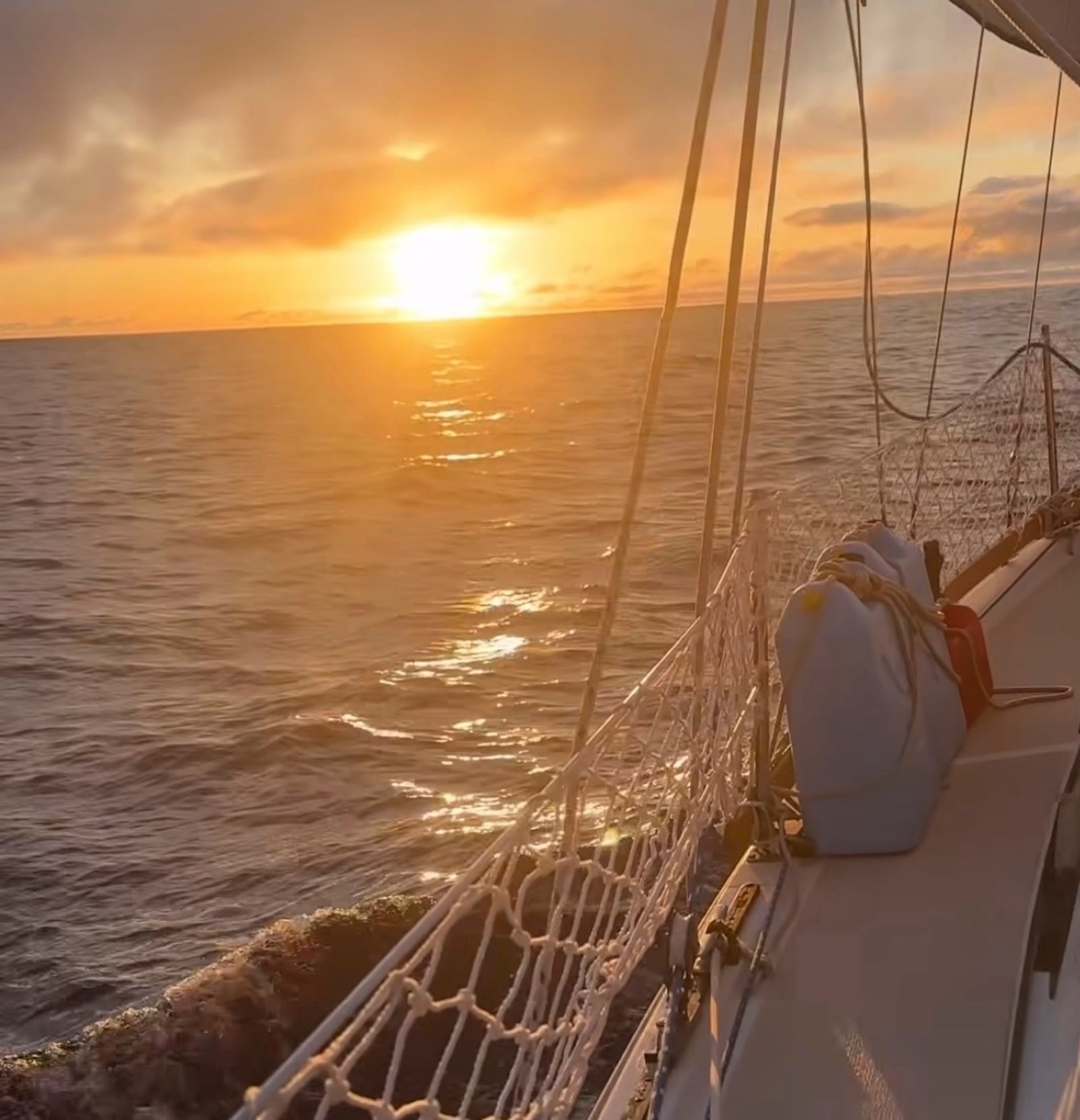 In this screengrab taken from a video posted on Oliver Widger's Instagram account on Friday, May 9, 2025, Widger shows the sunset somewhere in the Pacific Ocean as he and his cat, Phoenix, sail from Oregon to Hawaii. (Oliver Widger via AP)