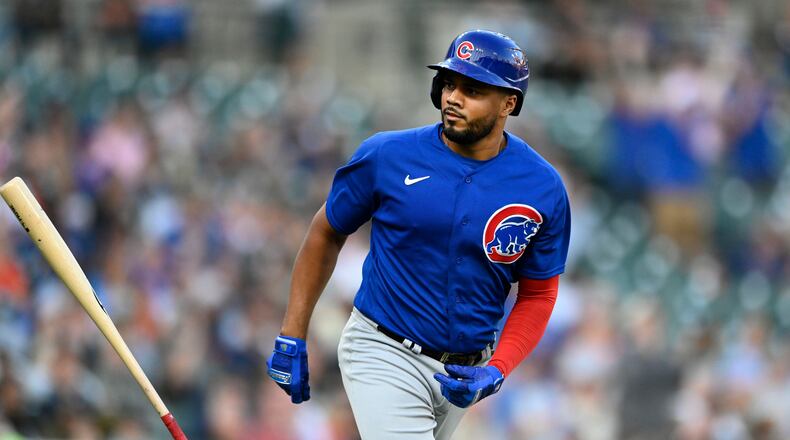 Chicago Cubs' Jeimer Candelario flips his bat after hitting a two-run home run off Detroit Tigers starting pitcher Reese Olson during the fourth inning of a baseball game Tuesday, Aug. 22, 2023, in Detroit. (AP Photo/Jose Juarez)