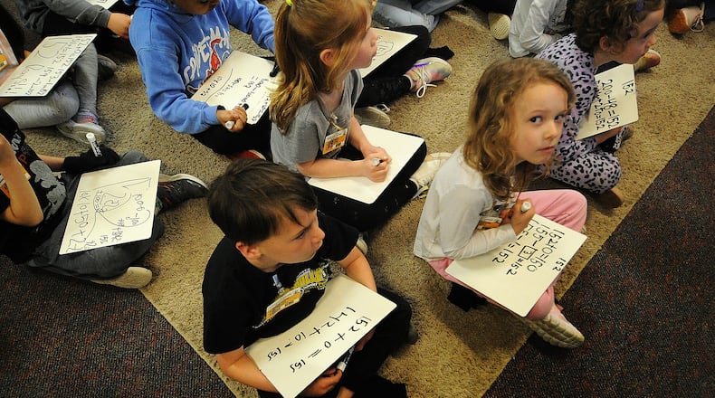 First grade students in Sarah Jacobs math class work on addition and subtraction skills Monday, April 22, 2024 at the Primary Village North school in Centerville. MARSHALL GORBY\STAFF