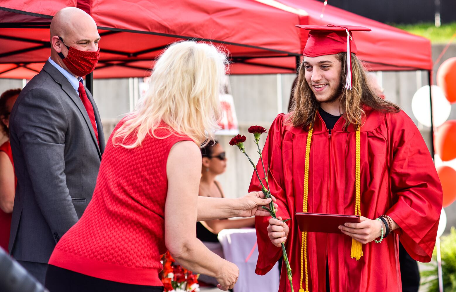 Madison High School drive-thru graduation ceremony at Land of Illusion