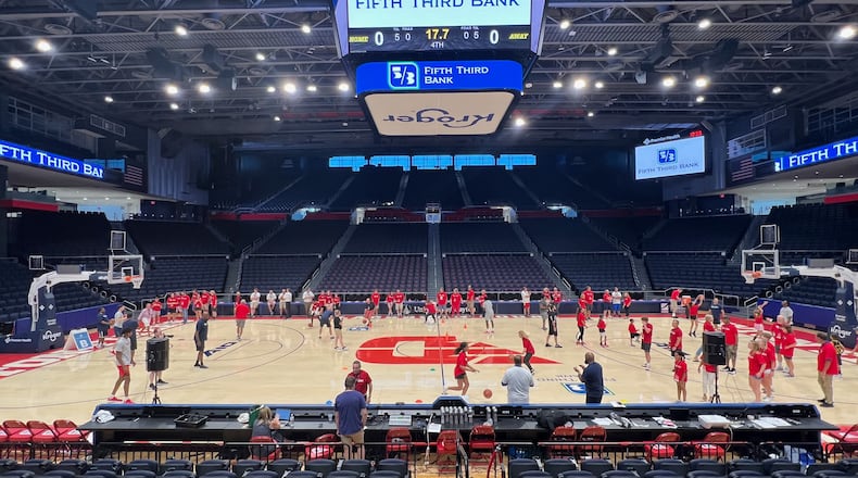 Dayton players work with kids at a basketball camp at UD Arena. Contributed photo