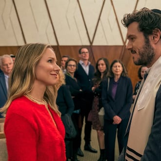This image released by Netflix shows Kristen Bell, left, and Adam Brody in a scene from "Nobody Wants This." (Stefania Rosini/Netflix via AP)