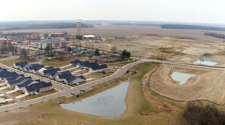 Union Village, the 1,400-acre planned community in Warren County, is under construction. Land features are beginning to emerge across from Otterbein. Over the next 30 or more years, $1.5 billion in investment, 4,500 homes and 12,000 residents are projected in this community anchored by the Warren County Sports Park at Union Village. TY GREENLEES / STAFF