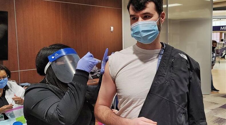 As area schools wrap up the 2020-2021 school year, which was the first full year in more than a century conducted during a global pandemic, officials are hopeful for a return to normalcy by classes start in August. Middletown teachers (pictured) were the first in the state in January to receive vaccination shots. (File Photo\Journal-News)