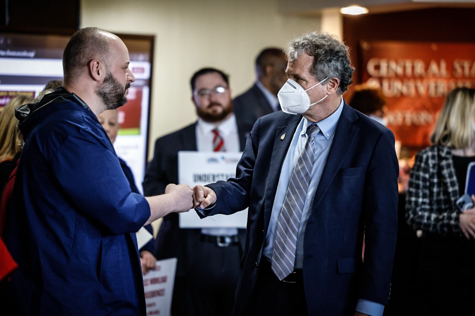 Ohio Sen. Sherrod Brown fist pumps Wexner Medical Center at OSU nurse, Rick Lucas at a press conference Tuesday April 11, 2023 at Central State West Campus. Senator Brown is co-sponsoring a bill in congress, S.1113, called the nurse staffing standards for hospital patient safety and quality act. It also did not make it past getting introduced in Congress. JIM NOELKER/STAFF